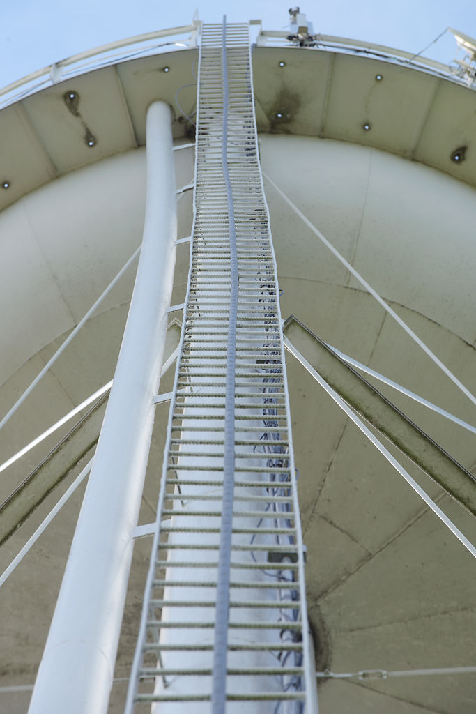 A ladder leads up to the top of the Syracuse water tower